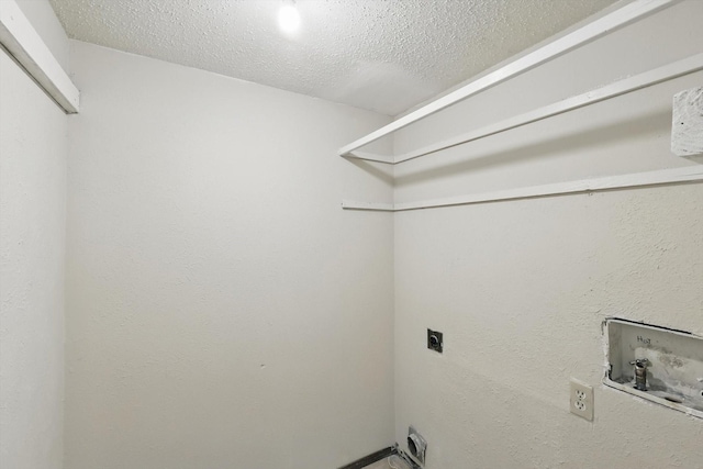 laundry room with washer hookup, laundry area, hookup for an electric dryer, and a textured ceiling