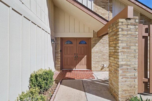 property entrance with brick siding