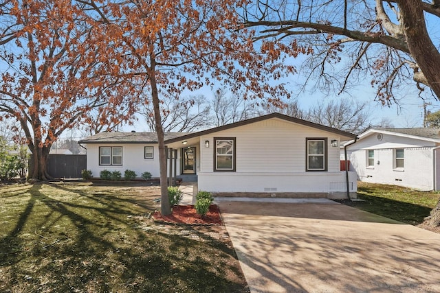 ranch-style house with crawl space, driveway, a front yard, and fence