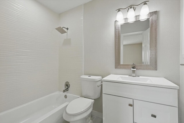 bathroom with toilet, vanity, a textured wall, and shower / washtub combination