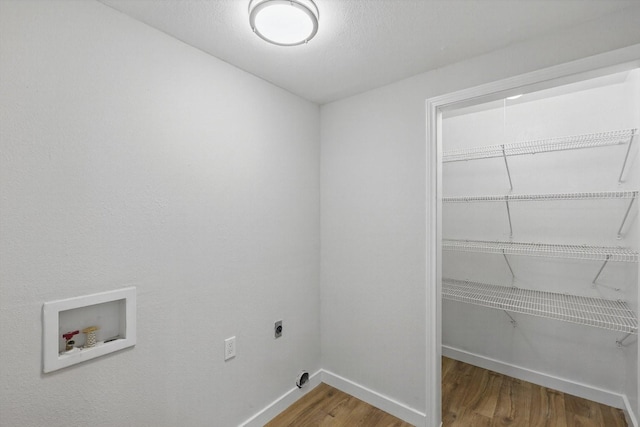 laundry room featuring wood finished floors, hookup for an electric dryer, laundry area, baseboards, and hookup for a washing machine