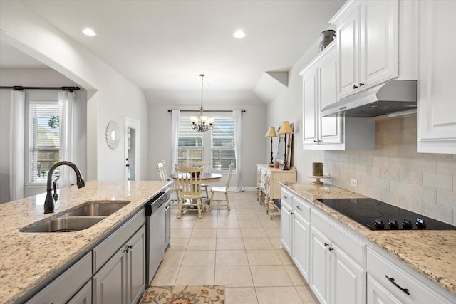 kitchen with black electric stovetop, under cabinet range hood, a sink, gray cabinets, and dishwasher