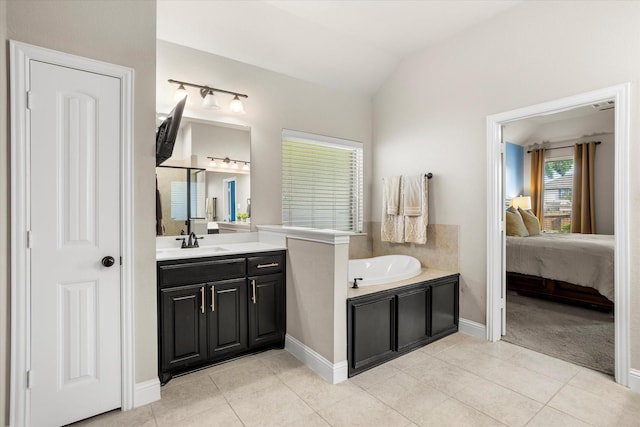 full bathroom featuring connected bathroom, tile patterned floors, vaulted ceiling, vanity, and a bath