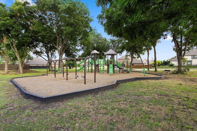 community playground with a lawn and fence