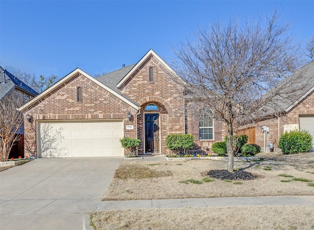 view of front of home featuring a garage, brick siding, driveway, and a shingled roof