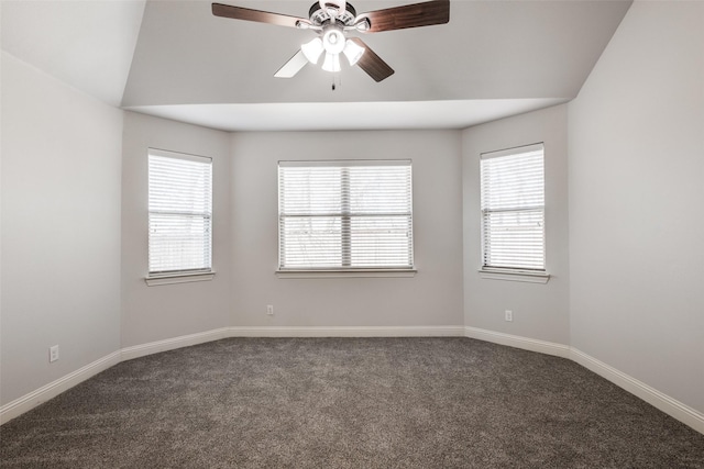 carpeted empty room with plenty of natural light, baseboards, and ceiling fan