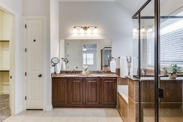 full bathroom with a sink, a bath, and tile patterned floors