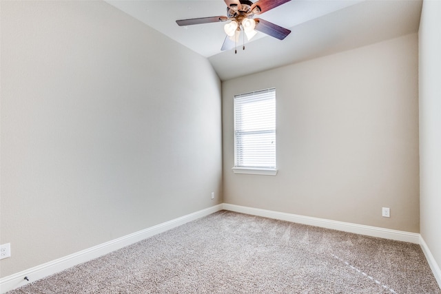 empty room with lofted ceiling, carpet, baseboards, and ceiling fan