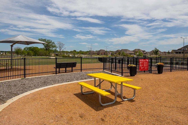 view of jungle gym featuring fence