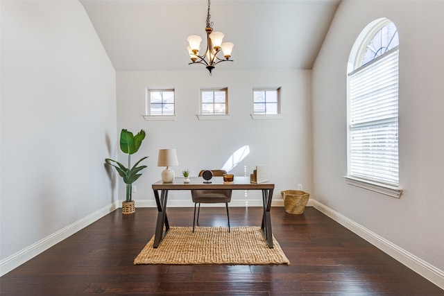 office space featuring lofted ceiling, plenty of natural light, baseboards, and hardwood / wood-style flooring