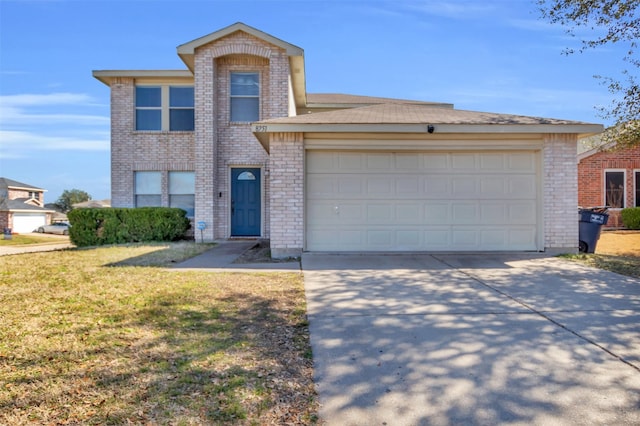 traditional home featuring an attached garage, driveway, a front yard, and brick siding