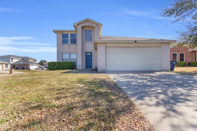 view of front of property featuring a garage, driveway, brick siding, and a front lawn