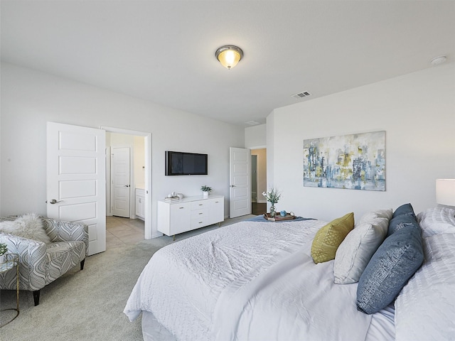 bedroom featuring light carpet and visible vents