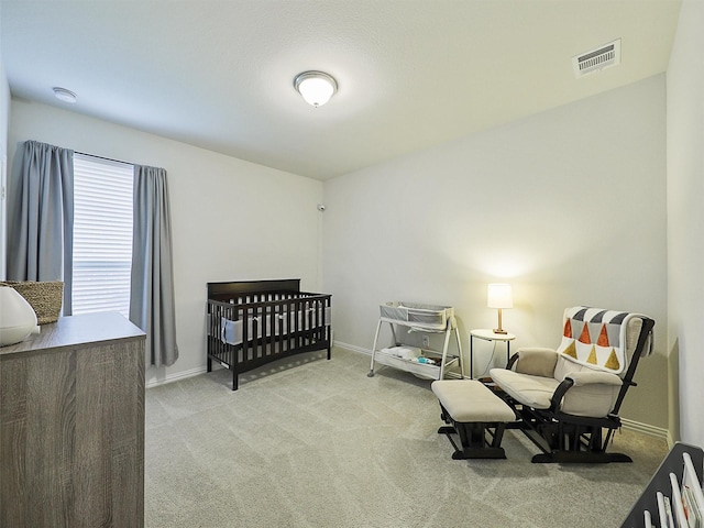 bedroom featuring carpet, visible vents, and baseboards