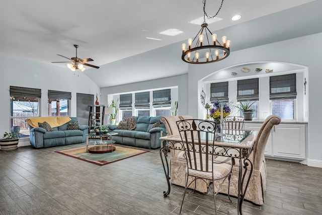 108 Gateway Dr, Alvarado, TX 76009 - dining area featuring ceiling fan with notable chandelier, vaulted ceiling, and wood finished floors