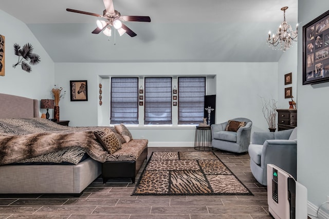 living room featuring wood finish floors, vaulted ceiling, and ceiling fan with notable chandelier