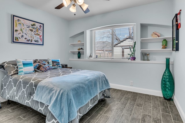 bedroom featuring baseboards, ceiling fan, and wood tiled floor