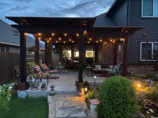 view of patio with fence and an outdoor living space