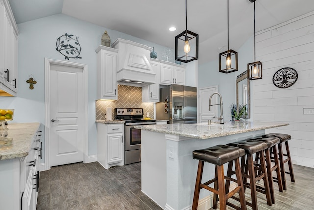 kitchen featuring premium range hood, appliances with stainless steel finishes, white cabinets, and dark wood-style flooring