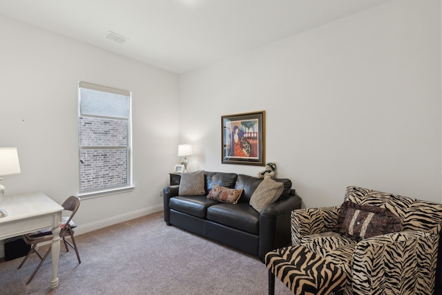 carpeted living room featuring visible vents and baseboards