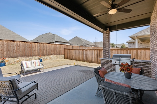 view of patio / terrace featuring a grill, a ceiling fan, outdoor dining area, and a fenced backyard