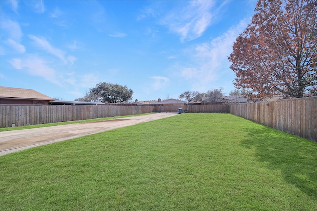 view of yard with a fenced backyard