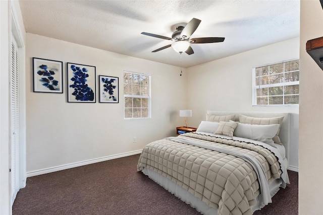 bedroom featuring carpet, baseboards, and a ceiling fan