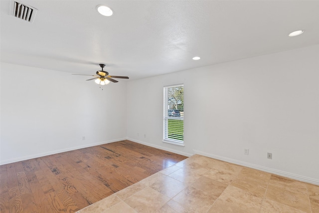 empty room featuring ceiling fan, recessed lighting, visible vents, and baseboards