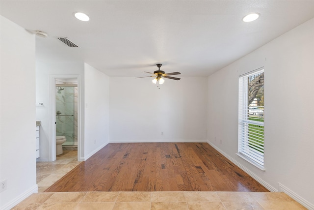 unfurnished room featuring ceiling fan, recessed lighting, wood finished floors, visible vents, and baseboards