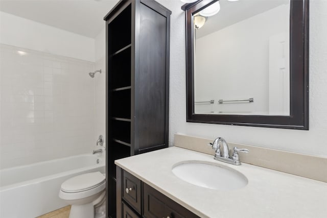 bathroom with washtub / shower combination, vanity, and toilet