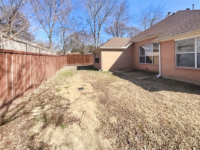 view of yard featuring a fenced backyard