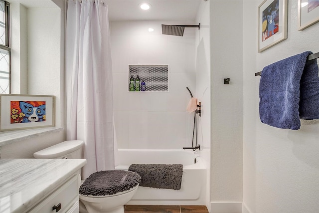 full bathroom with shower / bath combo, vanity, and toilet