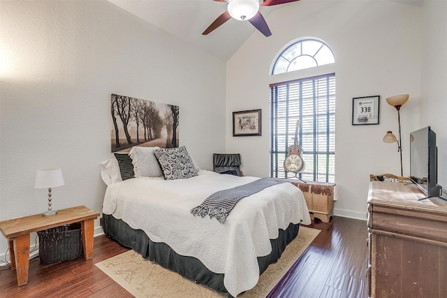 bedroom with lofted ceiling, wood finished floors, a ceiling fan, and baseboards