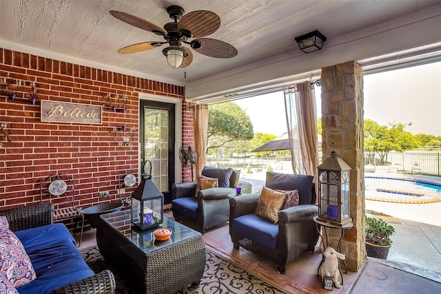 view of patio featuring ceiling fan, fence, and a fenced in pool