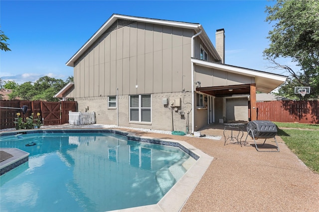 view of pool featuring a patio area, fence, and a fenced in pool