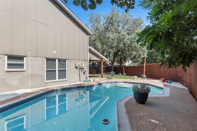 view of pool with a patio area, a fenced backyard, and a fenced in pool