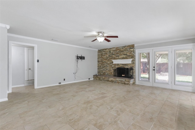 unfurnished living room featuring ceiling fan, a fireplace, baseboards, and crown molding