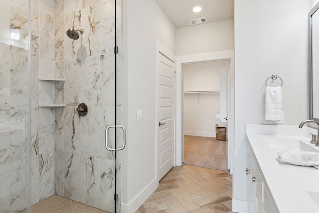 3830 Dalea Dr, Prosper, TX 75078 - bathroom with a sink, visible vents, a spacious closet, a marble finish shower, and double vanity