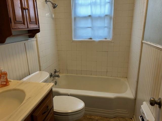 full bathroom with toilet, radiator, vanity, and shower / bathtub combination