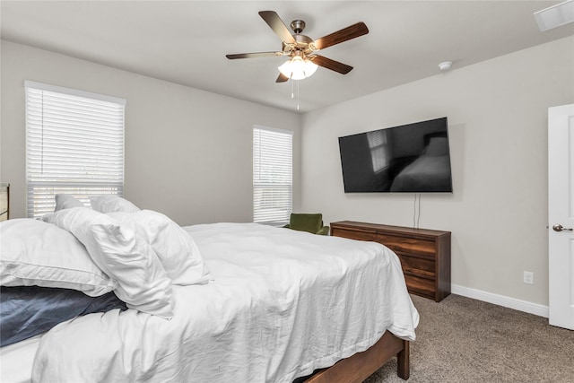 bedroom featuring multiple windows, carpet flooring, visible vents, and baseboards