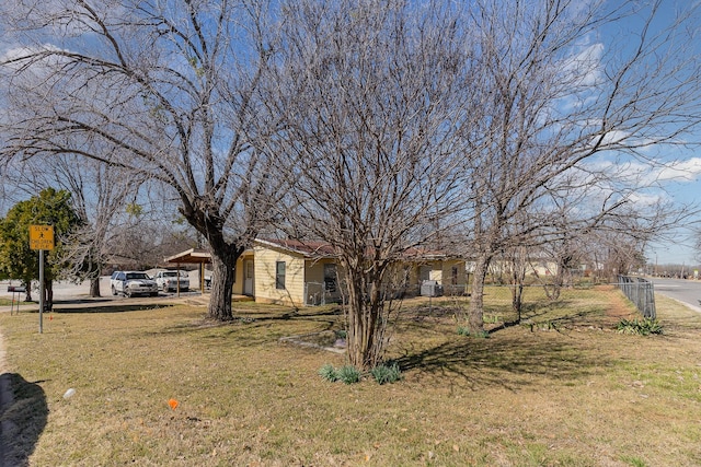 view of front of property with a front yard and fence