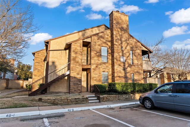 2109 Horizon Trl Unit 4014, Arlington, TX 76011 - unfurnished living room featuring a ceiling fan, baseboards, dark wood-style floors, a brick fireplace, and recessed lighting