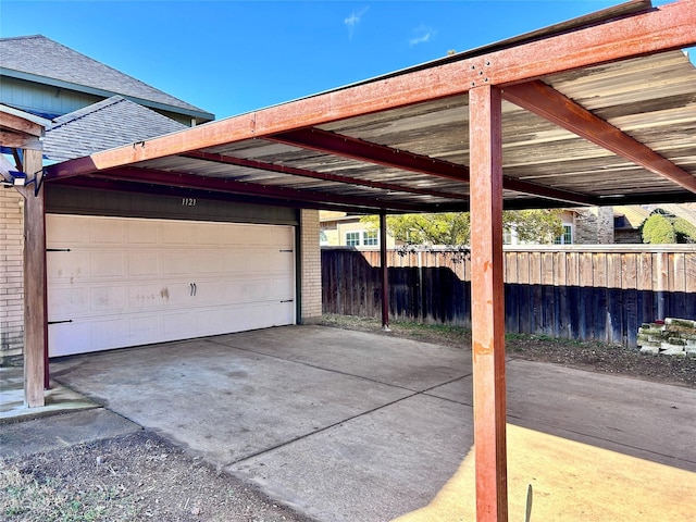 exterior space featuring a garage and fence