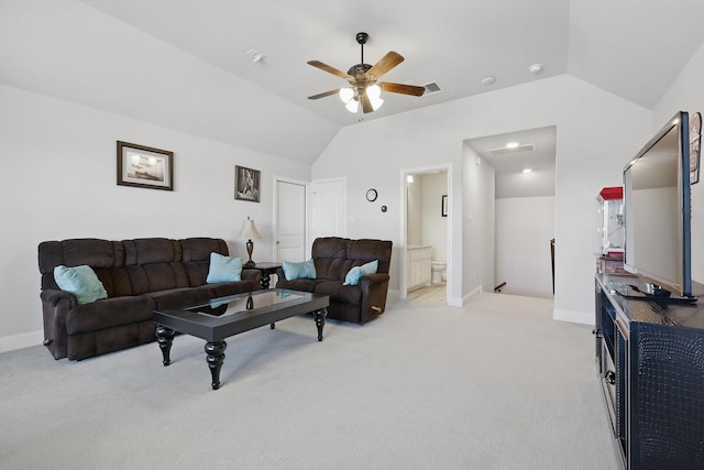 living room featuring lofted ceiling, light colored carpet, ceiling fan, and baseboards