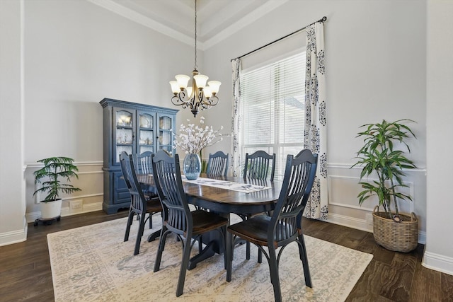 dining room with baseboards, a chandelier, and dark wood-type flooring