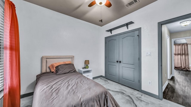 bedroom featuring marble finish floor, baseboards, visible vents, and ceiling fan