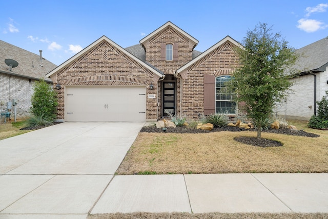 view of front of property with a garage, a front yard, concrete driveway, and brick siding