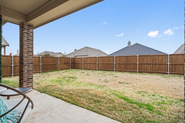 view of yard with a patio and a fenced backyard