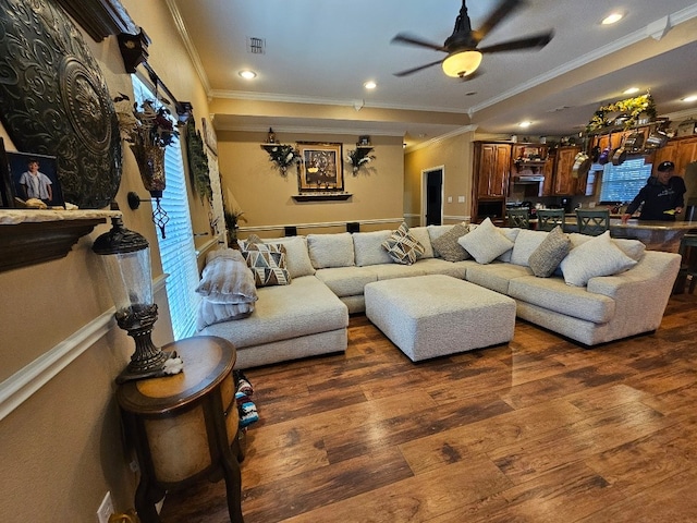 living room with crown molding, recessed lighting, a ceiling fan, and wood finished floors
