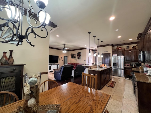 dining area with light tile patterned floors, ceiling fan, recessed lighting, and crown molding